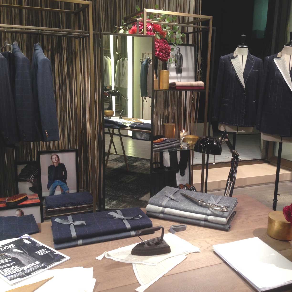 Inside a Max Mara store, with a selection of refined, tailored suits.