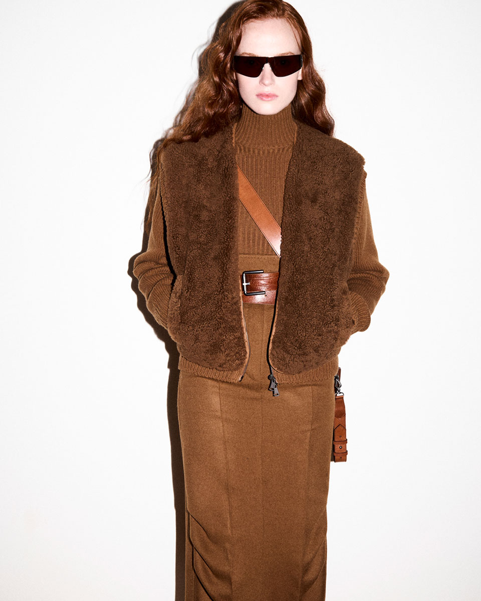 Max Mara Fall/Winter 2025 Fashion Show - Backstage shot of model with Leather Look with Brown Mask Sunglasses.